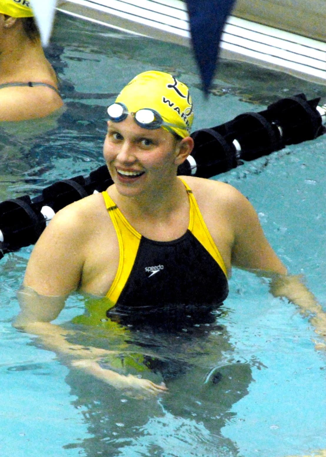 Meg Emery smiling at a swim meet