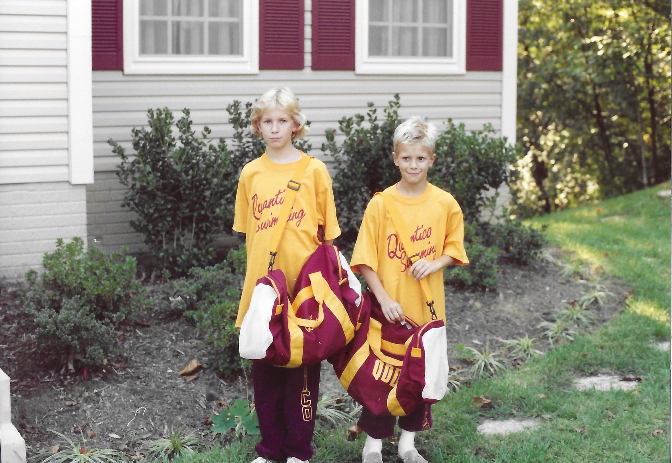 Sean and sibling in Quantico Swimming team shirts